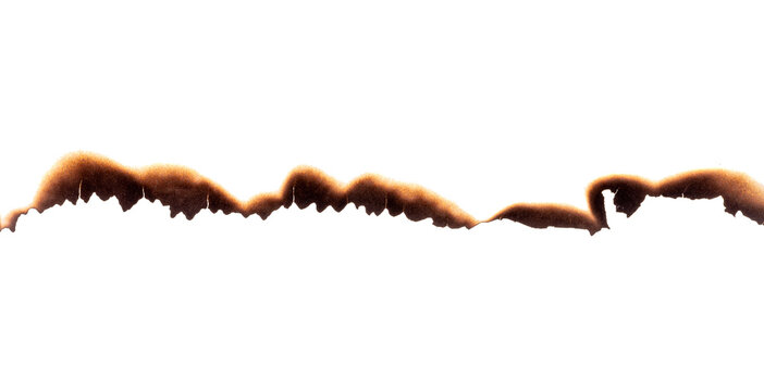 Burnt paper edge with dark scorch marks and curved burned shape