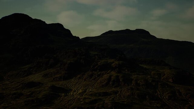Moody volcanic plateau under cloudy sky, basalt outcrops and cratered textures evoke ancient geology, dramatic setting for volcanology studies and atmospheric