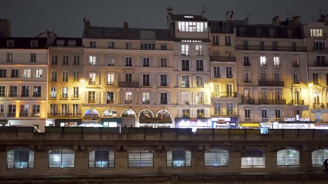 Paris houses at night at Seine River