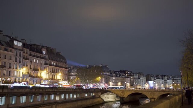 Paris houses at Seine River at night with bridge