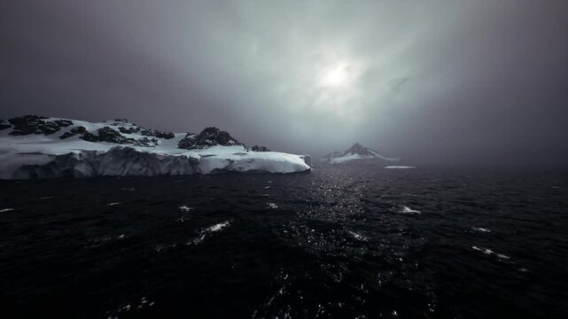 Approach to icy shore with distant mountain peak, choppy black water and drifting floes, expedition mood with navigational tension and raw natural power