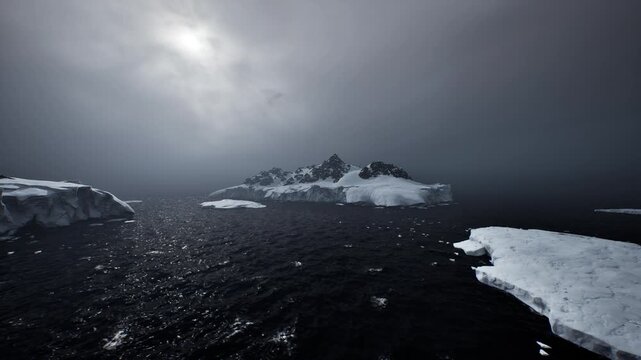 Dim ocean under heavy cloud bank, low diffuse light glinting off scattered ice, distant jagged peak emerging from mist, reflective black water with subtle