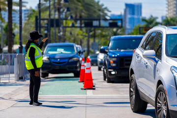 Crossing guard directing traffic on Fort Lauderdale Beach