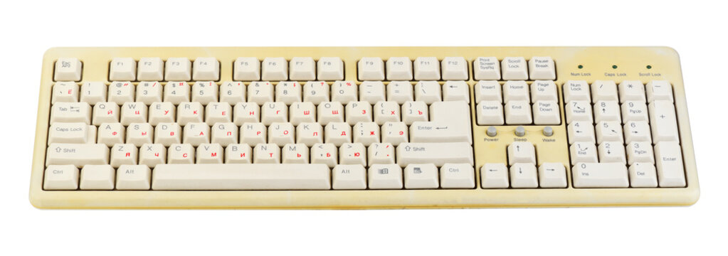 Vintage computer keyboard from the 1990s isolated on white background.