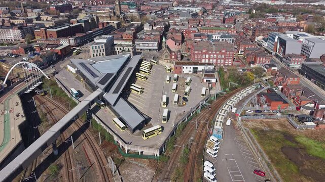BOLTON, GREATER MANCHESTER, ENGLAND - MARCH 18, 2026: Aerial view of Bolton Interchange, the modern bus and rail transport hub on Great Moor Street, slow tilt down