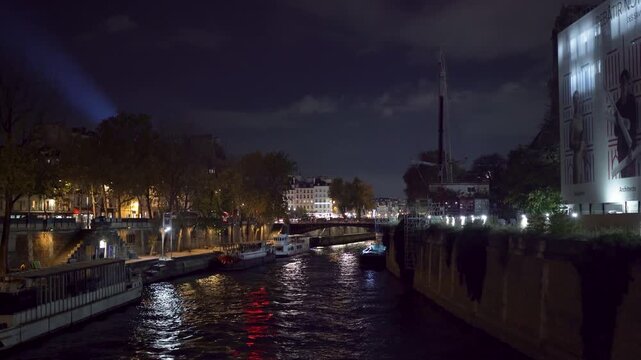 Paris Seine River at night with boats at &Icirc;le de la Cit&eacute;