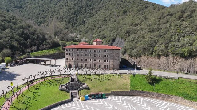 Aerial drone view of the stone exterior facade of Santo Toribio Monastery in Potes Cantabria Spain on a sunny day