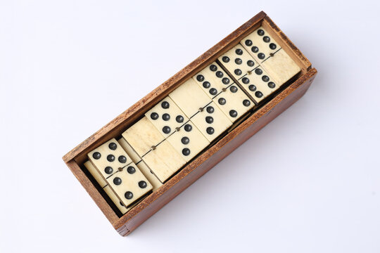 Vintage Domino Tiles in Wooden Box on White Background