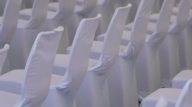 Large scale seating setup with many chairs prepared for an audience in a big event or conference environment.