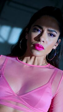 Woman beauty model reacting on cue, shifting gaze while animated shadow lines framing pink lipstick