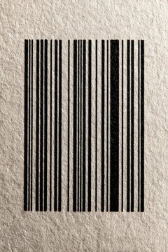 Black barcode printed on rough paper texture for packaging and label design background with vertical stripes and visible fiber detail for commerce layouts