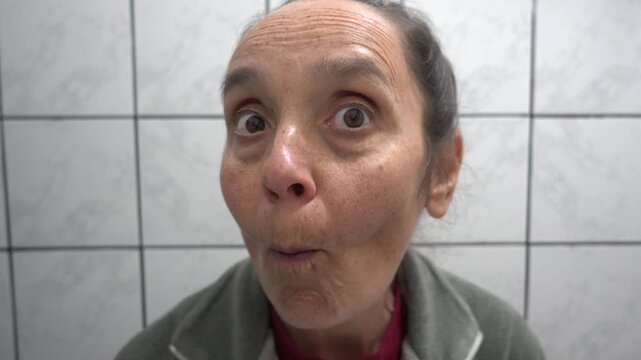 Kas, Turkey - 9 of February 2026: 4K Curious woman peeps in the mirror 
