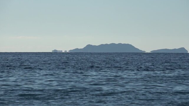 Kas, Turkey - 14 of February 2026: 4K Zoom in Fata Morgana superior mirage of islands over the sea horizon
