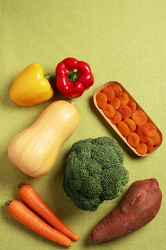 Flat lay border background of beta carotene rich foods, top view