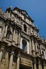 Fototapeta premium Iconic ruins of St Paul Cathedral historic stone facade with sculptures and carvings in Macau UNESCO heritage