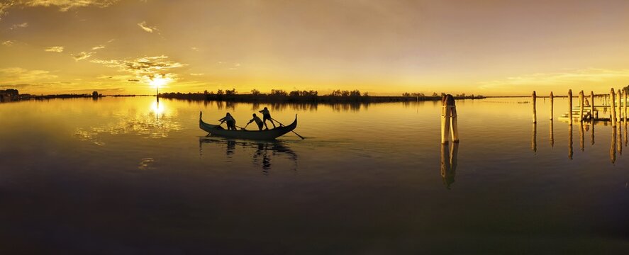 Sunset in Cavallino Harbour, gondola, evening light, Venice, Italy