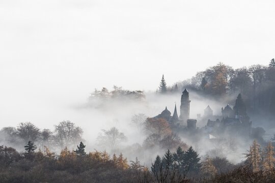 Fog, L&ouml;wenburg castle in the Bergpark Wilhelmsh&ouml;he landscape park, UNESCO World Heritage Site, Kassel, Hesse, Germany