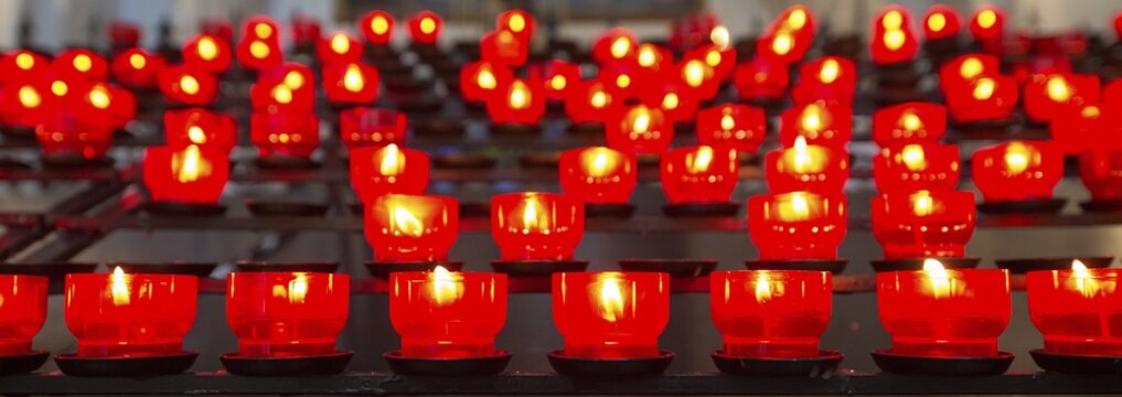 Burning votive candles in a church, Munich, Upper Bavaria, Bavaria, Germany