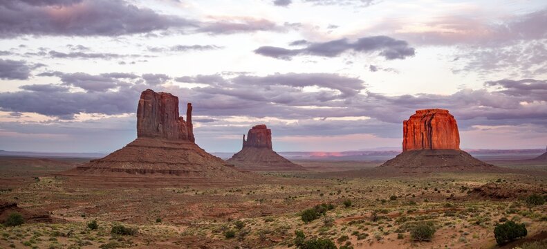 Red glowing rock formation at sunset, Table mountains West Mitten Butte, East Mitten Butte, Merrick Butte, Monument Valley, Navajo Tribal Park, Navajo Nation Reservation, Arizona, Utah, USA