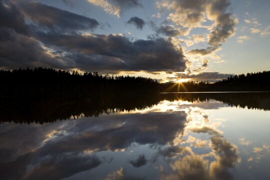 Sunset over a lake near Ormemyr, Telemark, Norway, Scandinavia, Europe