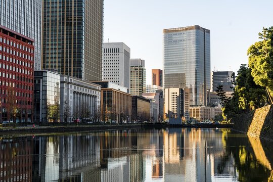 High-rise buildings reflected in a canal, downtown Toyko, at Kokyo Gaien National Garden, Chiyoda, Tokyo, Japan