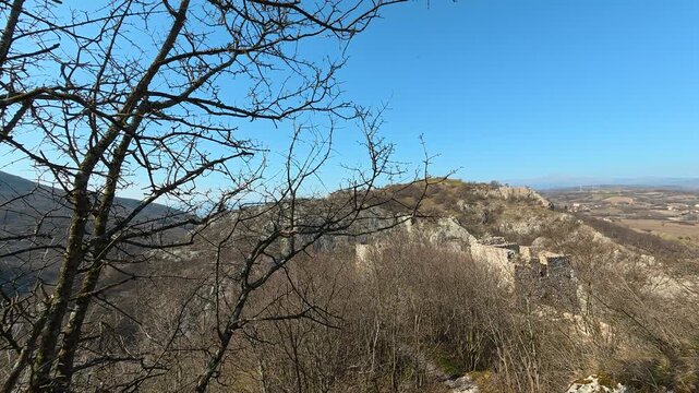Distant Medieval Fortress Through Autumn Tree Branches. Ozren Mountain, Soko Grad. Balkans, Serbia.