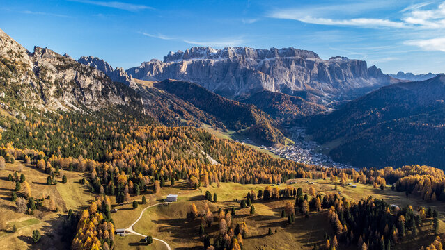 Aerial autumn view of Val Gardena with Sella Group and Selva village