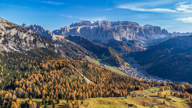 Aerial view of Selva di Val Gardena and the Sella Group in the Dolomites in autumn