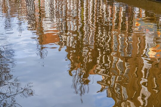 Row of houses reflected in a canal, Amsterdam, Holland, Netherlands