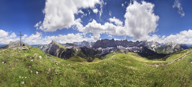 360 &deg; panoramic view from Mt Mahnkopf of the summits of the Karwendel Range, summit cross and dramatic cloud formation, near the Falkenhuette hut, Tyrol, Austria, Europe