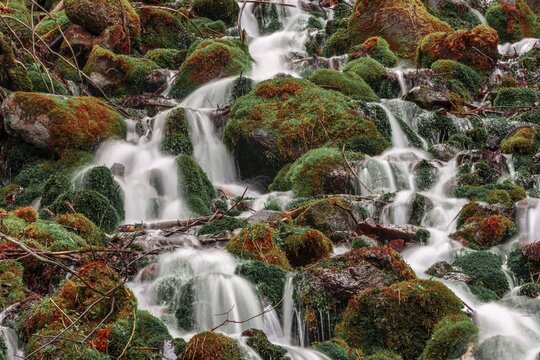 Waterfall, water flows over mossed stones, Nagano, Matsumoto, Japan