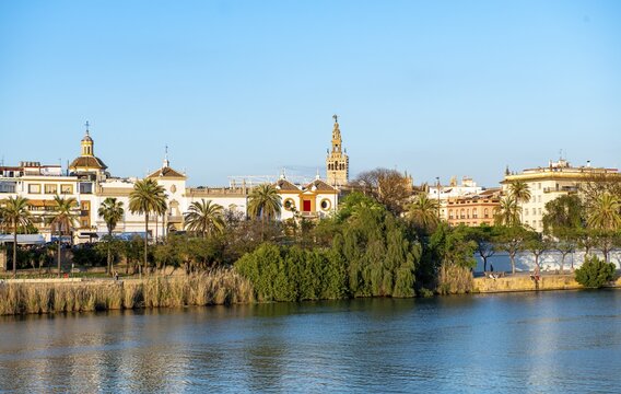 View over the river Rio Guadalquivir to the bullring Plaza de toros de la Real Maestranza de Caballer&iacute;a de Sevilla and bell tower La Giralda, Sevilla, Andalusia, Spain