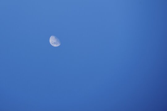 Waning crescent in the daytime sky, blue sky, Austria