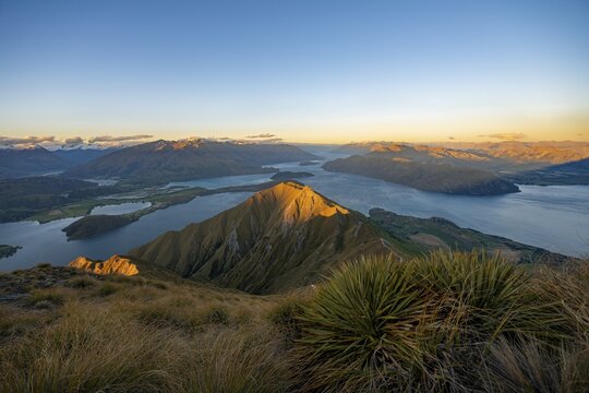 View of mountains and lake from Mount Roy, Roys Peak at sunset, Lake Wanaka, Southern Alps, Otago, South Island, New Zealand