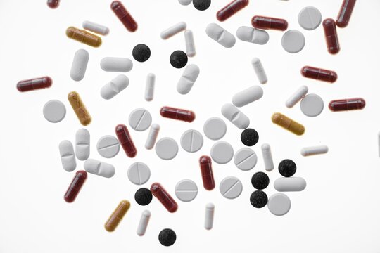 Colourful tablets, capsules, pills and drag&eacute;es, against a white background, Germany