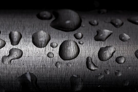 Water droplets on a stainless steel pipe