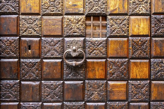 Wooden ornately carved entrance door, Ca' d'Oro Palace, Venice, Veneto, Italy