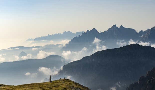 Silhouettes of mountains with small clouds in between, Sexten Dolomites, South Tyrol, Trentino-South Tyrol, Alto-Adige, Italy