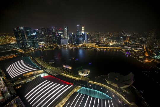 Marina Bay and ArtScience Museum at night, financial district behind, skyscrapers, Singapore