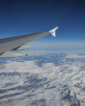 View of mountains and snowy landscape from the airplane, airplane wing of an Airbus A380, aerial view, Anatolia, Northeastern Turkey, Turkey