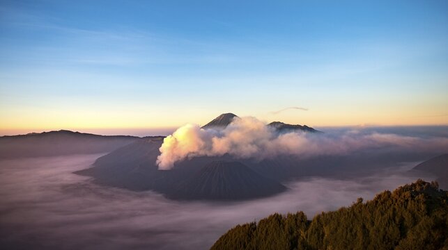 View of volcanoes at sunrise, smoking volcano Gunung Bromo, Batok, Kursi, Gunung Semeru, Bromo-Tengger-Semeru National Park, Java, Indonesia