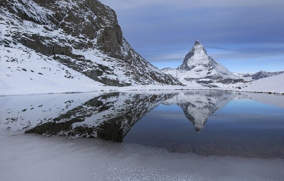 Matterhorn reflected in the Riffelsee, Zermatt, Valais, Switzerland
