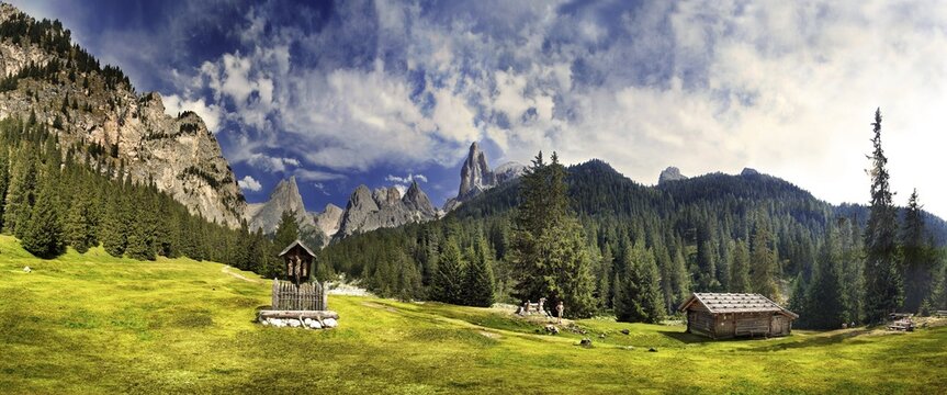 Panoramic shot: idyllic scenery, wayside cross and Alpine cabin, San Cyprian, Tiers, Bolzano-Bozen, Italy, Europe