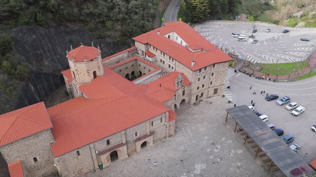 Aerial drone view of the stone exterior facade of Santo Toribio Monastery in Potes Cantabria Spain on a sunny day