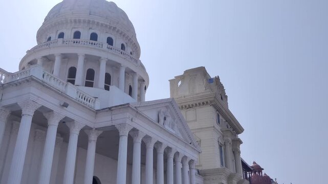 Kota, Rajasthan, India 5 March 2026: Footage of miniature of Capitol building in Washington DC of United States of America shot at Chambal Riverfront of Kota against a beautiful sky in background duri