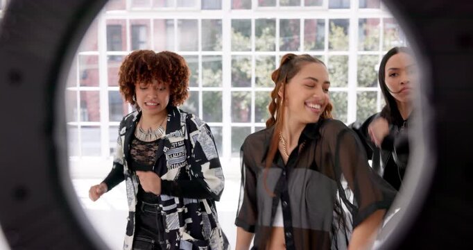 Video, friends and girls with ring light for dance in studio with live streaming, social media challenge and energy. Women, dancer or influencer filming a online hip hop tutorial for content creation