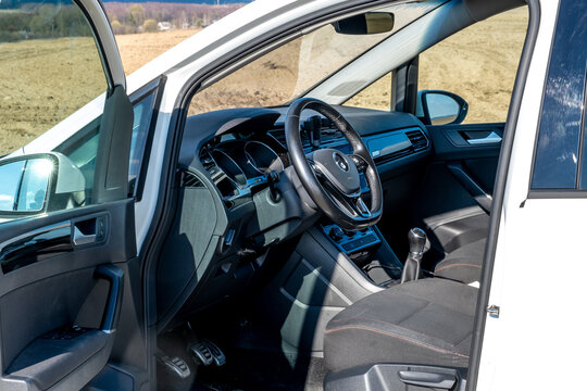 Modern car interior with steering wheel and dashboard