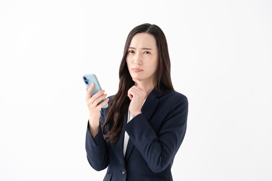ビジネス　困る女性　スマホ
