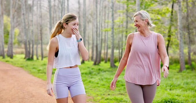 Mature mother, daughter and forest with walking for fitness, exercise and workout in Canada. Family, people and happy or smile with funny conversation for bonding, support and care in park for health