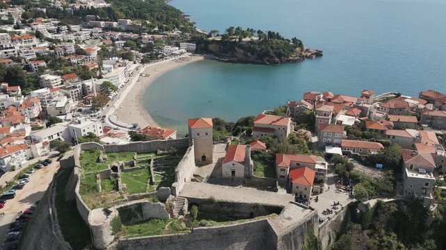 Aerial view of Old Town Ulcinj and sandy Adriatic shore in southern Montenegro.